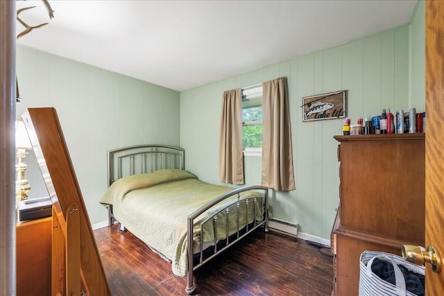 105 Beaver Ln, East Stroudsburg, PA 18301 - bedroom featuring wood finished floors, a baseboard radiator, and a decorative wall