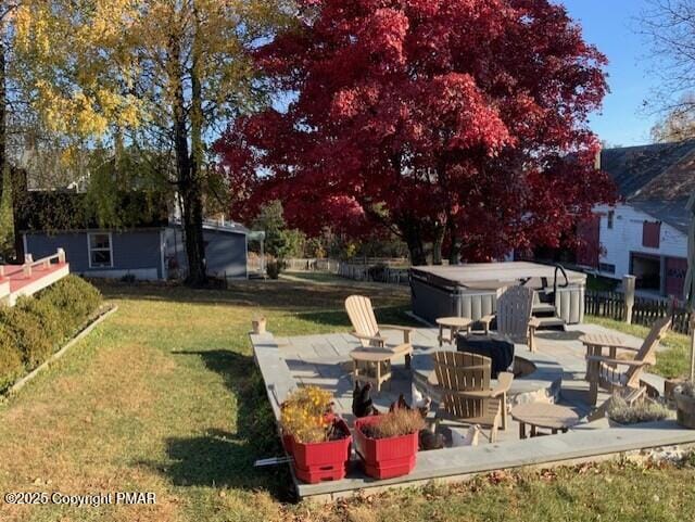 view of yard featuring a hot tub and a patio