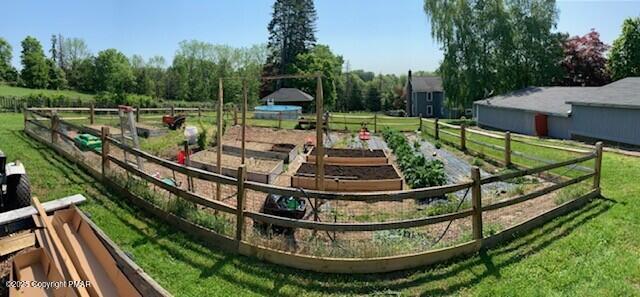 exterior space with a rural view and a yard