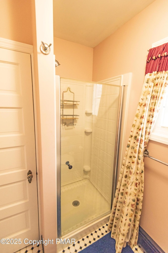 full bathroom featuring a shower stall