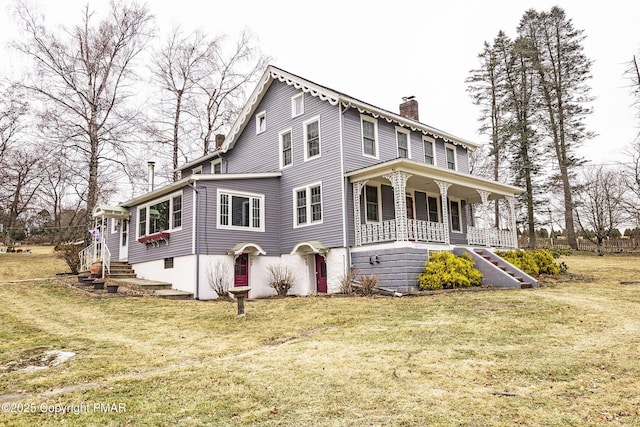 view of front of home with a chimney, a porch, and a front yard