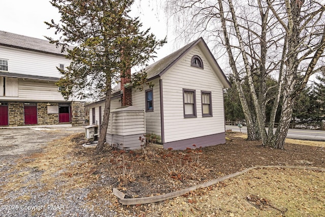 view of home's exterior with a chimney