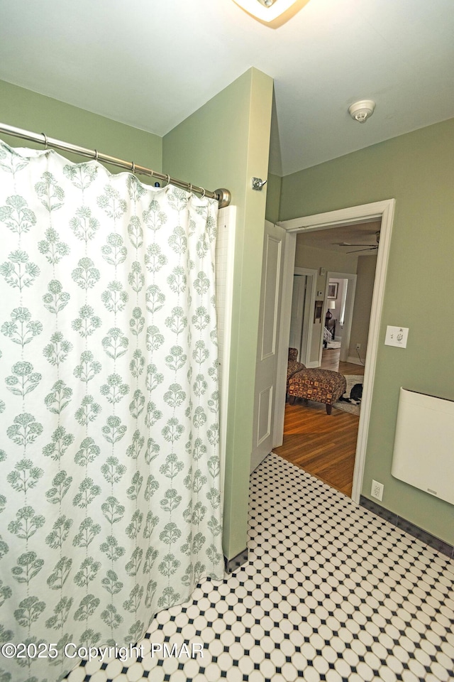 bathroom with a shower with curtain