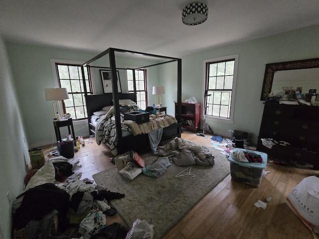 bedroom featuring wood finished floors