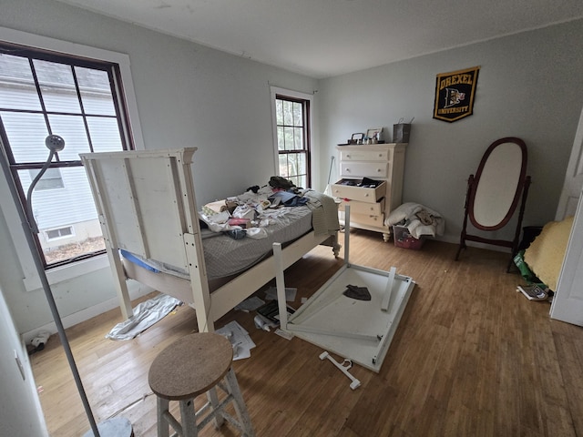 bedroom with wood finished floors