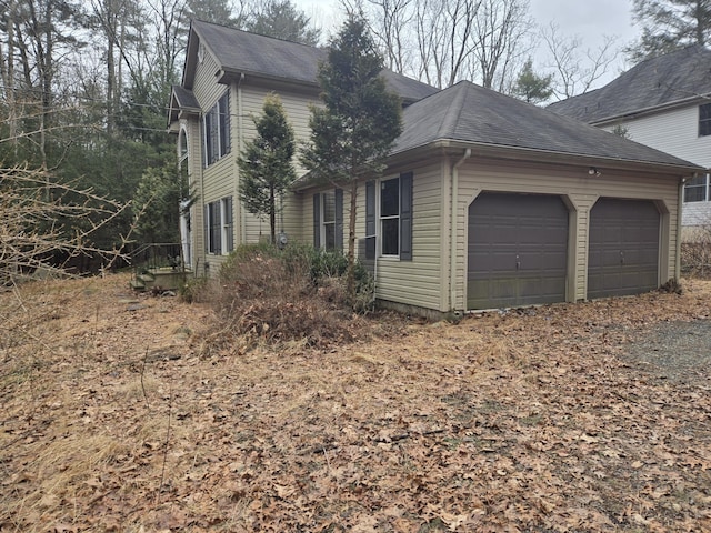 view of property exterior with a garage