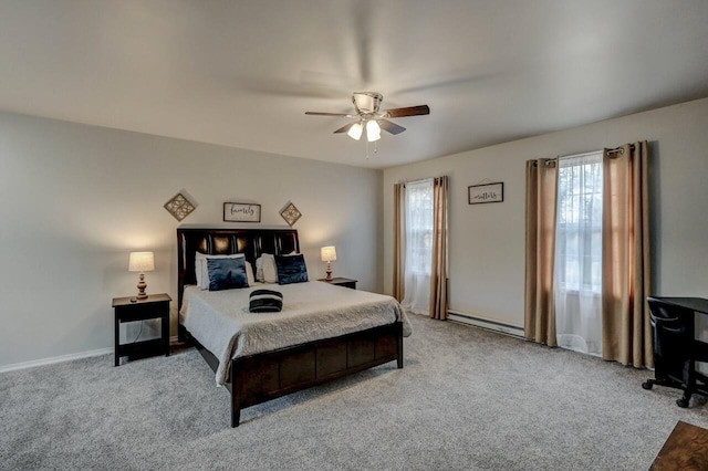 bedroom featuring baseboards, carpet floors, and a ceiling fan