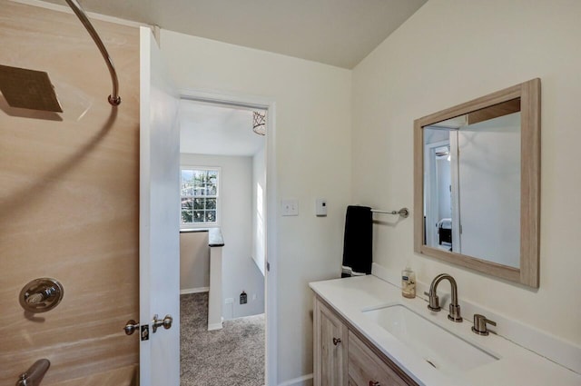 bathroom with baseboards and vanity