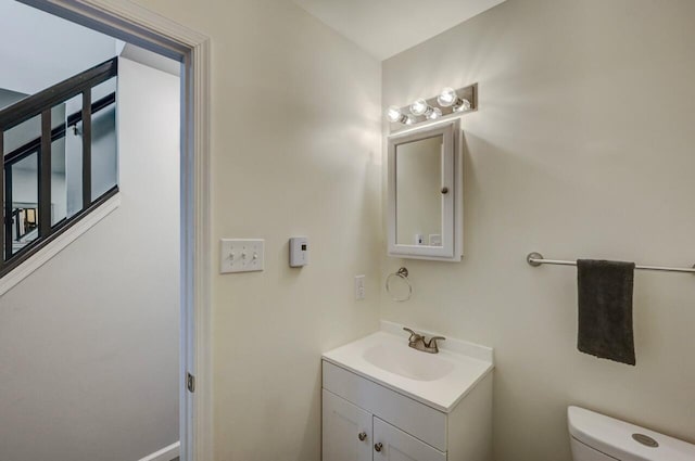 half bath with vanity and toilet