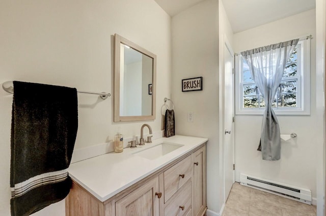 bathroom with tile patterned floors, vanity, and a baseboard radiator