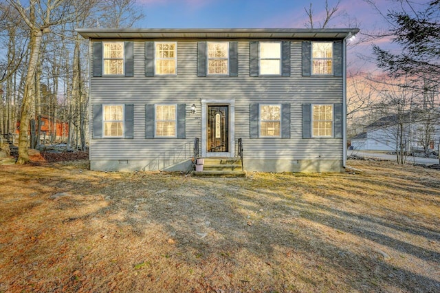 colonial inspired home featuring crawl space and entry steps