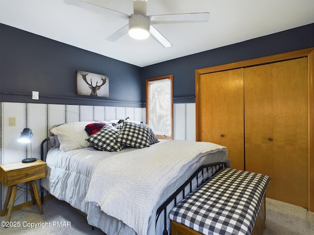 bedroom featuring ceiling fan, carpet flooring, and a closet