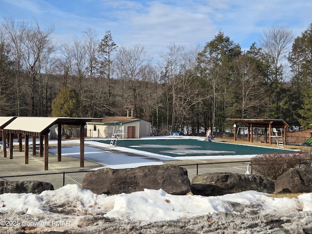 view of swimming pool with an outdoor structure