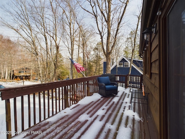 view of snow covered deck