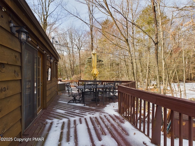 view of snow covered deck