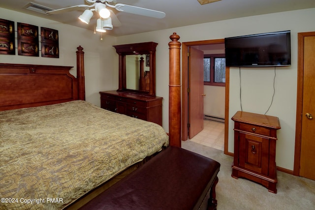 bedroom featuring tile patterned floors, visible vents, baseboard heating, and ceiling fan