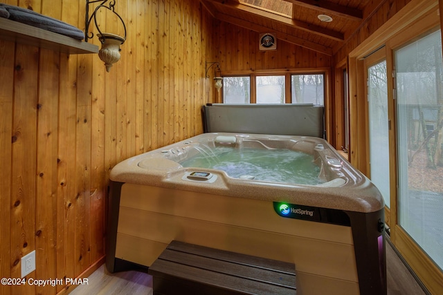 sunroom / solarium featuring vaulted ceiling, wooden ceiling, and a hot tub