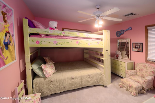 carpeted bedroom with visible vents and a ceiling fan