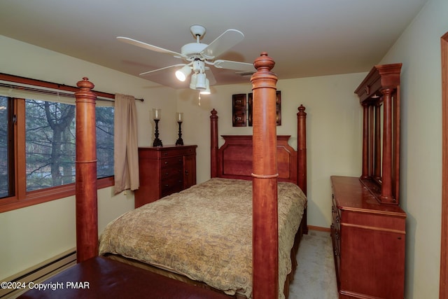 bedroom with carpet floors, a ceiling fan, and a baseboard radiator