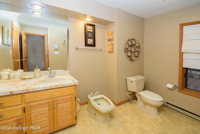 bathroom featuring vanity, a bidet, baseboards, a baseboard radiator, and toilet