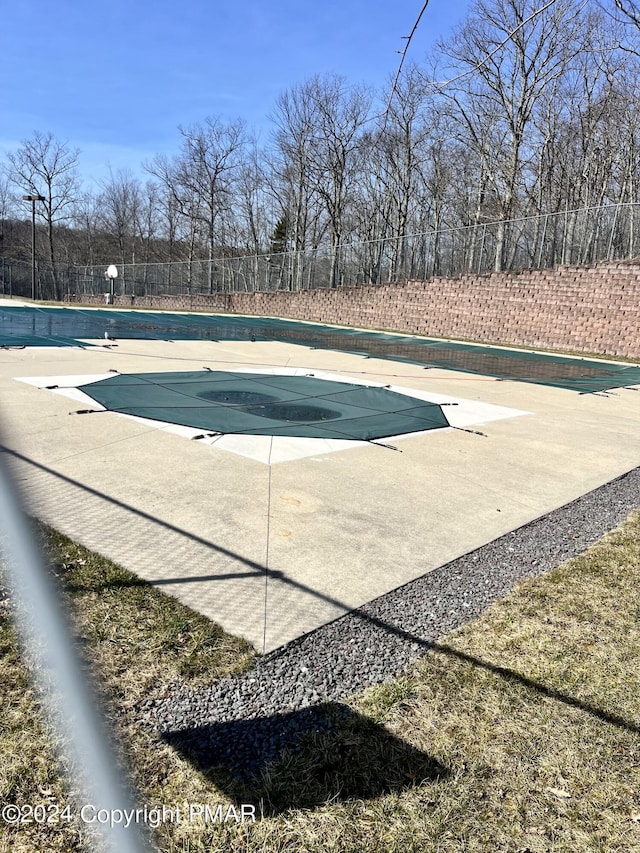 community pool featuring a patio area