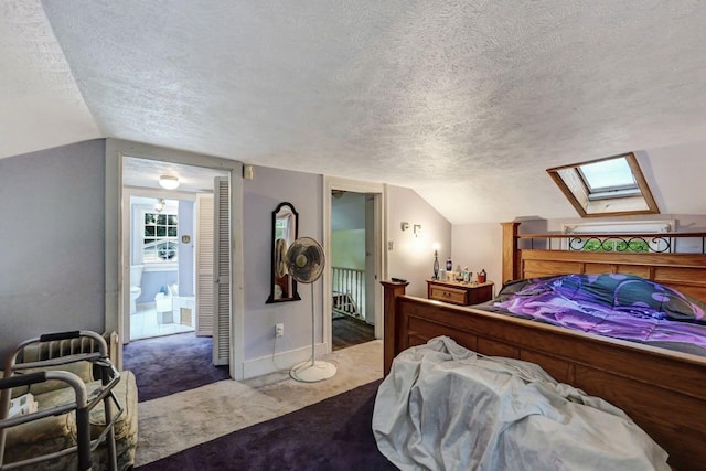 325 Mt Nebo Rd, East Stroudsburg, PA 18301 - bedroom featuring a textured ceiling, a skylight, carpet flooring, and vaulted ceiling