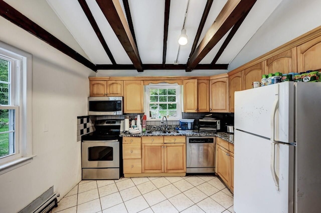 325 Mt Nebo Rd, East Stroudsburg, PA 18301 - kitchen with appliances with stainless steel finishes, a baseboard heating unit, tasteful backsplash, and light tile patterned flooring