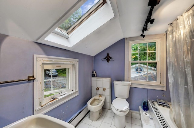 325 Mt Nebo Rd, East Stroudsburg, PA 18301 - full bathroom with a baseboard radiator, a bidet, a skylight, vaulted ceiling, and tile patterned flooring