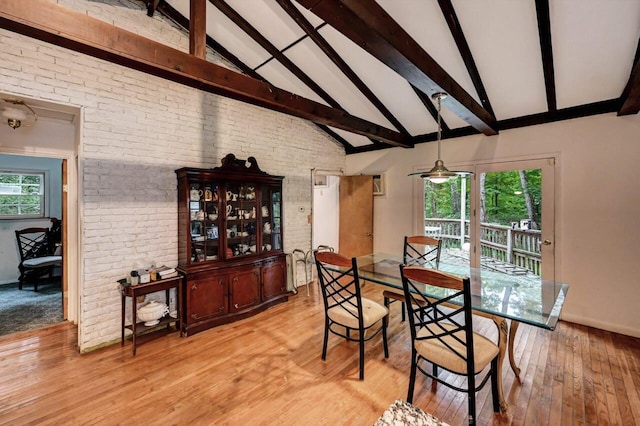 325 Mt Nebo Rd, East Stroudsburg, PA 18301 - dining space with beamed ceiling, light wood finished floors, brick wall, and high vaulted ceiling