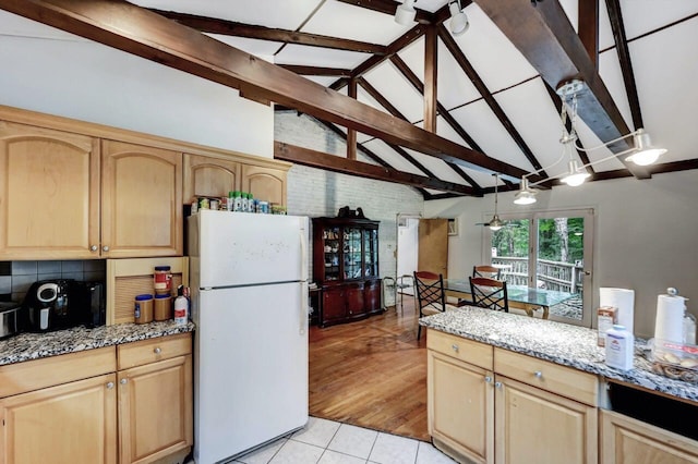 325 Mt Nebo Rd, East Stroudsburg, PA 18301 - kitchen with freestanding refrigerator, light brown cabinets, beam ceiling, light tile patterned flooring, and light stone counters