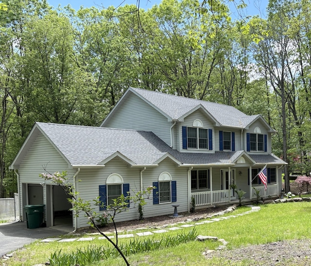 476 Sassafrass Way, Stroudsburg, PA 18360 - view of front of property with covered porch, roof with shingles, a garage, driveway, and a front lawn