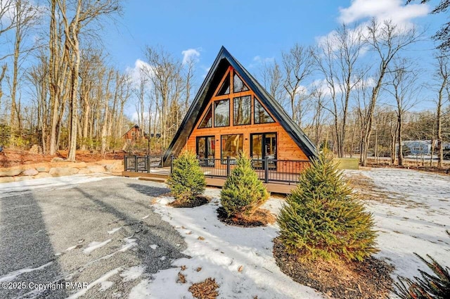 a-frame home with a deck