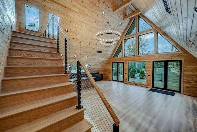 4142 Calendula Ct, Pocono Pines, PA 18350 - stairway featuring high vaulted ceiling, wood walls, a chandelier, a wooden ceiling with exposed beams, and wood finished floors