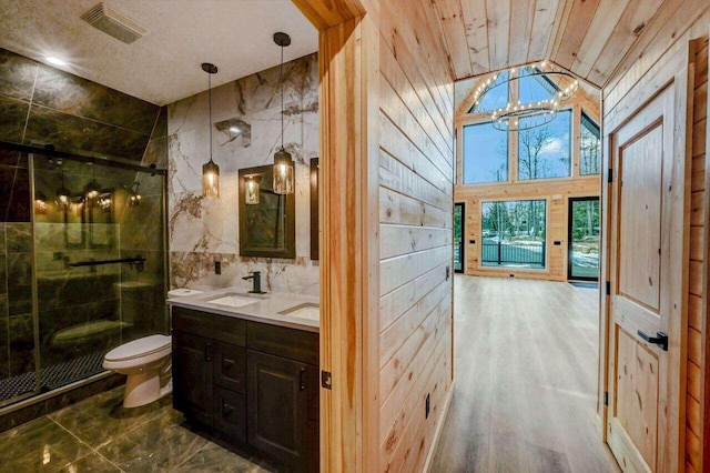 4142 Calendula Ct, Pocono Pines, PA 18350 - full bath with vaulted ceiling, double vanity, a shower stall, wooden walls, and a chandelier