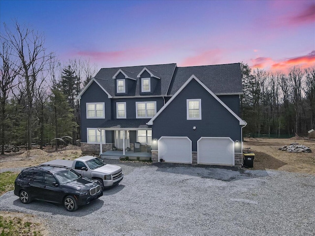 116 Red Bud Ln, Kunkletown, PA 18058 - traditional-style house featuring covered porch, stone siding, a garage, asphalt driveway, and a shingled roof