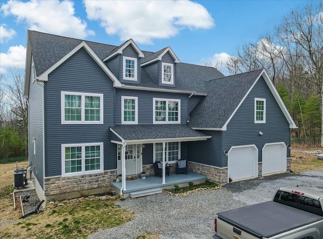 116 Red Bud Ln, Kunkletown, PA 18058 - view of front facade with a porch, stone siding, a shingled roof, and a garage