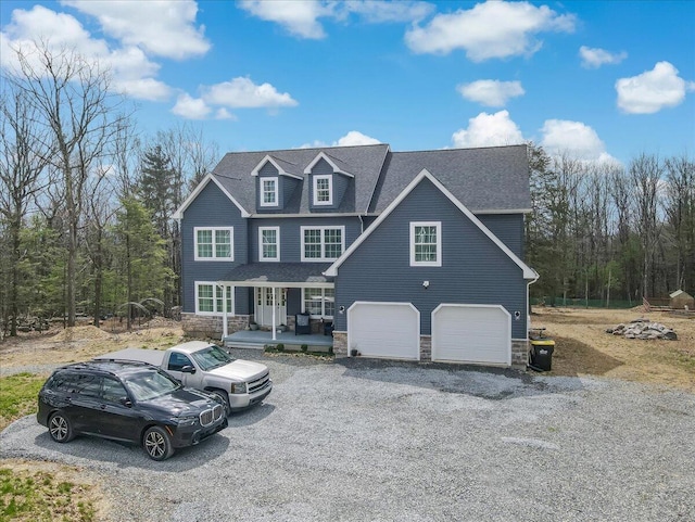 116 Red Bud Ln, Kunkletown, PA 18058 - view of front of property with a porch, stone siding, a garage, a shingled roof, and gravel driveway