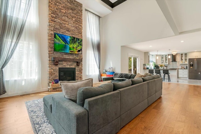 116 Red Bud Ln, Kunkletown, PA 18058 - living area with a towering ceiling, light wood-style floors, a fireplace, and recessed lighting