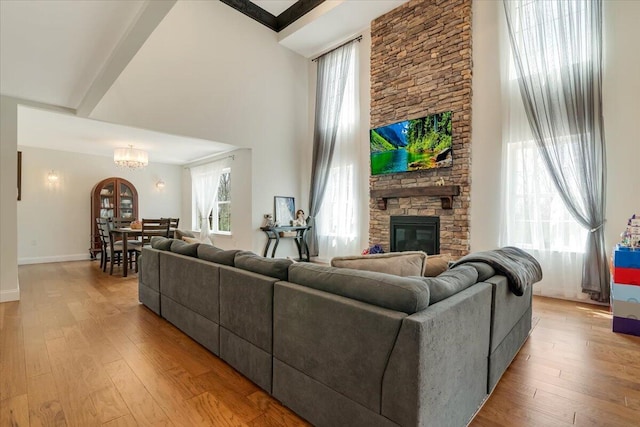 116 Red Bud Ln, Kunkletown, PA 18058 - living area featuring a chandelier, a fireplace, light wood-style flooring, and a towering ceiling