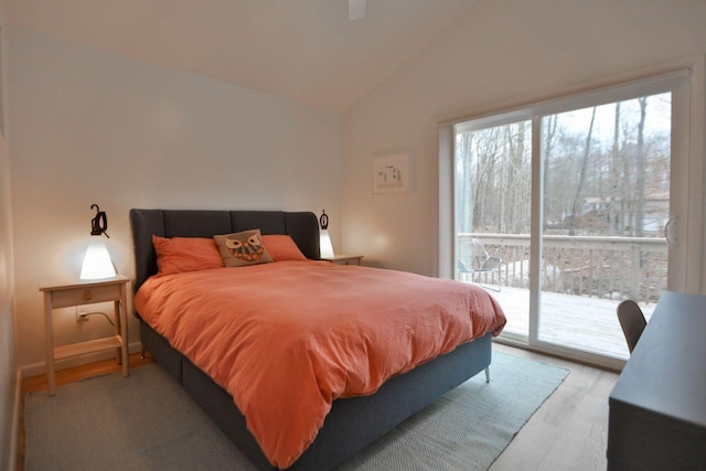 290 Wyomissing Dr, Pocono Lake, PA 18347 - bedroom with access to outside, light wood-style floors, and vaulted ceiling
