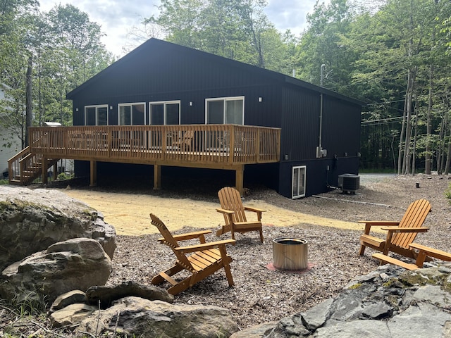 290 Wyomissing Dr, Pocono Lake, PA 18347 - back of property featuring cooling unit, a deck, stairway, and an outdoor fire pit
