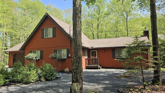 1196 Redwood Ter, Pocono Pines, PA 18350 - view of front facade featuring a chimney and a shingled roof