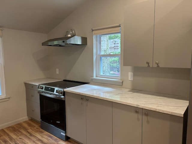 113 Netcong Cir, Pocono Lake, PA 18347 - kitchen with stainless steel electric range oven, wall chimney range hood, gray cabinetry, lofted ceiling, and light wood-type flooring
