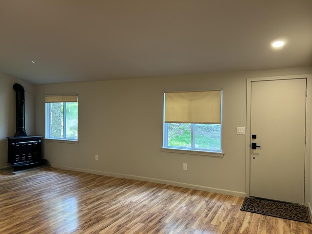 113 Netcong Cir, Pocono Lake, PA 18347 - foyer entrance with wood finished floors, a wood stove, and recessed lighting