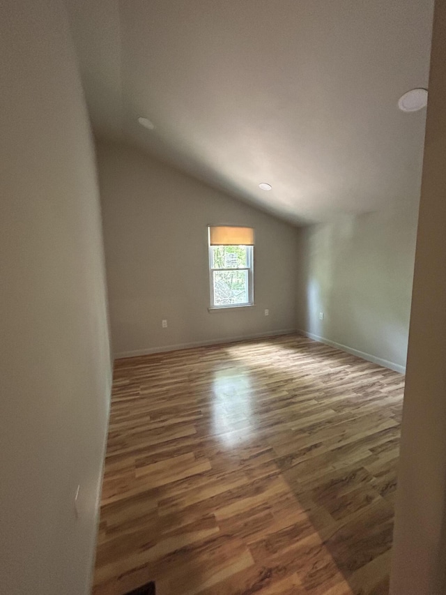 113 Netcong Cir, Pocono Lake, PA 18347 - unfurnished room with vaulted ceiling and wood finished floors