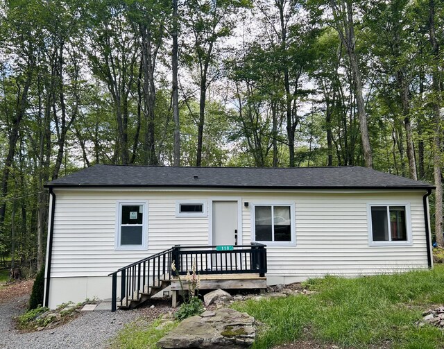 113 Netcong Cir, Pocono Lake, PA 18347 - ranch-style house with a wooden deck and a shingled roof
