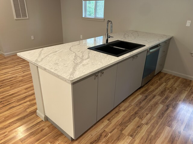 113 Netcong Cir, Pocono Lake, PA 18347 - kitchen with dishwasher, light wood finished floors, and light stone counters