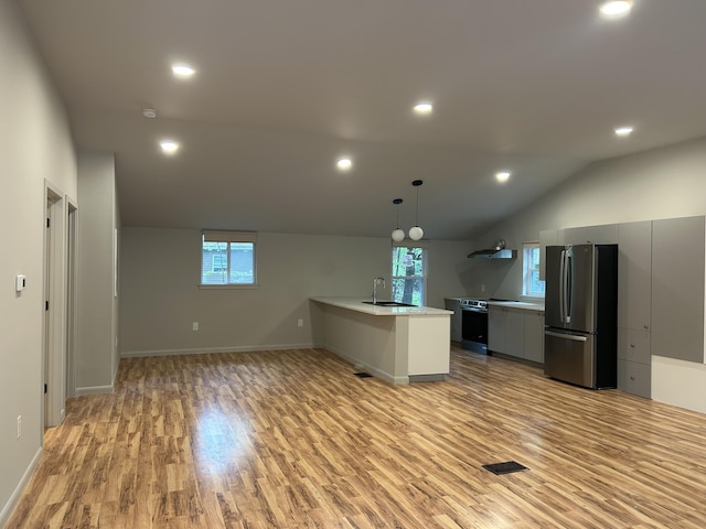 113 Netcong Cir, Pocono Lake, PA 18347 - kitchen featuring freestanding refrigerator, light countertops, light wood finished floors, healthy amount of natural light, and vaulted ceiling
