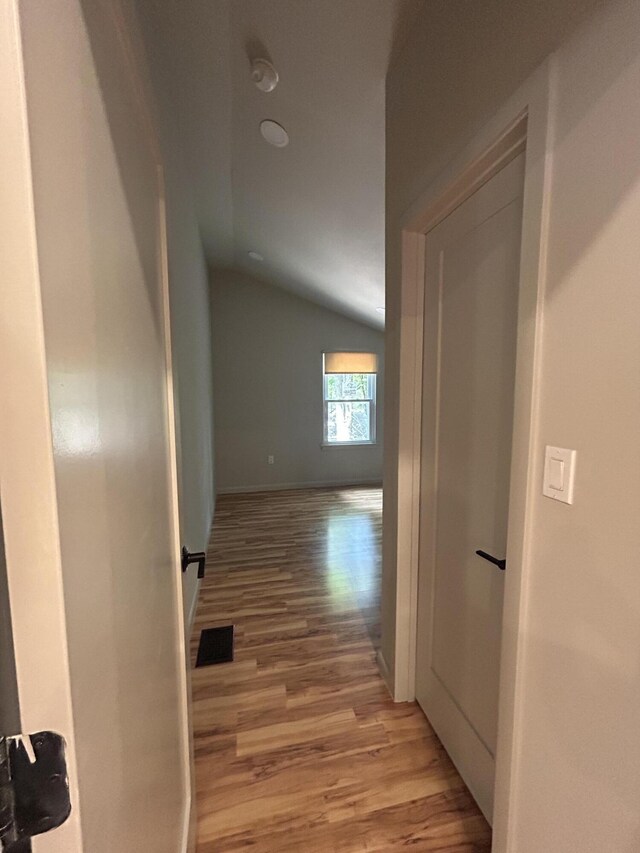 113 Netcong Cir, Pocono Lake, PA 18347 - corridor featuring lofted ceiling and light wood finished floors