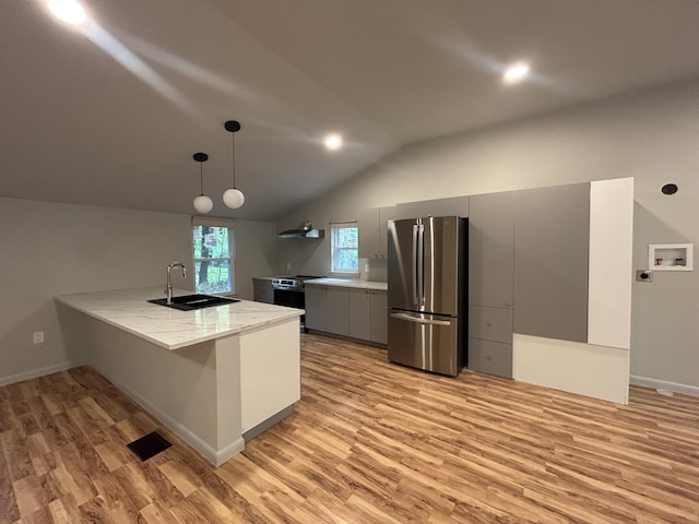 113 Netcong Cir, Pocono Lake, PA 18347 - kitchen with freestanding refrigerator, light wood-style flooring, lofted ceiling, a peninsula, and gray cabinetry